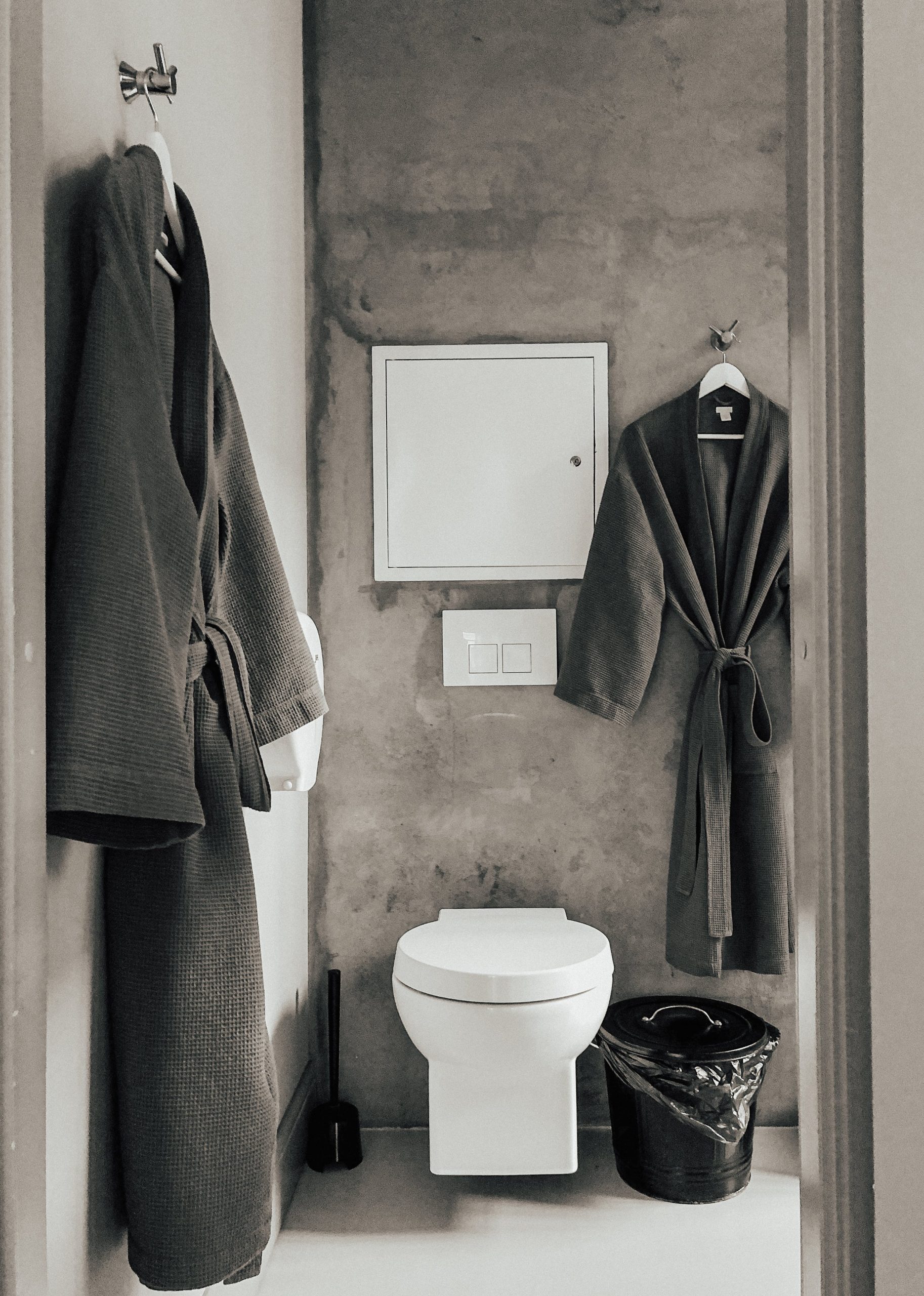 Gray Bathrobes Hanging in the Bathroom